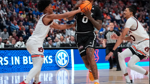 Mississippi State forward D.J. Jeffries (0) is fouled by Auburn guard Aden Holloway (1) as he drives during the first half of an NCAA college basketball game at the Southeastern Conference tournament Saturday, March 16, 2024, in Nashville, Tenn.